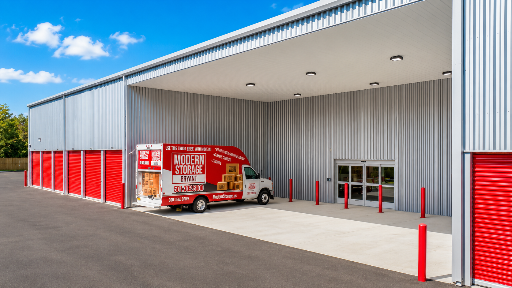 Modern Storage® Bryant covered loading awning with red doors, wide drive aisle, and convenient building access